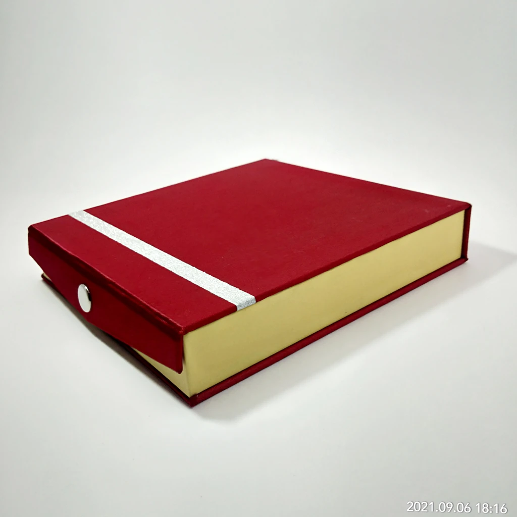 maroon satin strip inside white set box 